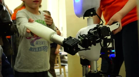 New technologies. Robot.  AI. Children playing with robots. Stock Footage 50301230