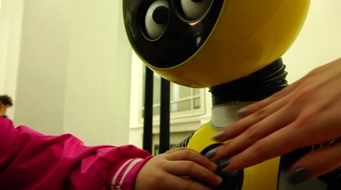 New technologies. Robot. AI. Children playing with robots. Stock Footage 50411364