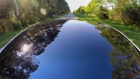 A new Tesla Model 3 drives down the road. Stock Footage 128446429