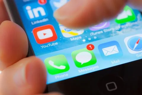 New text message on an apple iphone 4s Stock Photos