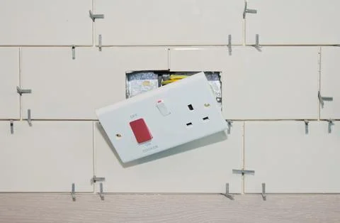 New tile installation in kitchen with electrical sockets removed Stock Photos