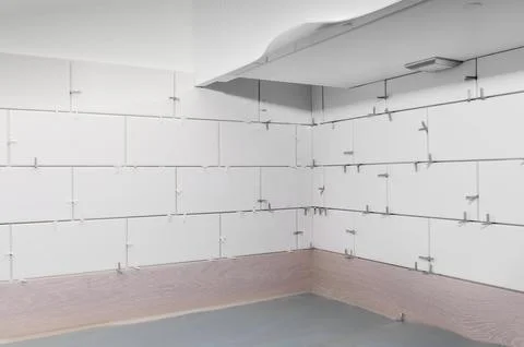 New tile installation in kitchen with electrical sockets removed Stock Photos