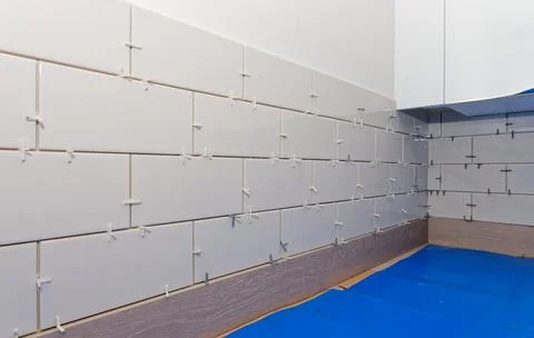 New tile installation in kitchen with electrical sockets removed Stock Photos