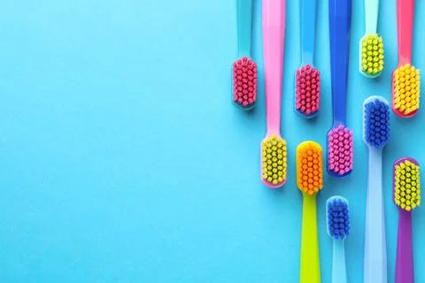 New Toothbrushes Over Blue Background Stock Photos
