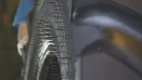 New Truck Tire with Spikes after Press Slow Motion Видео 85235755