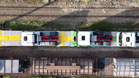 New trucks being transported on railway platforms, continuous flow of vehicles Video stock 341398514