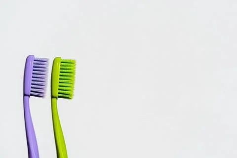 New two toothbrushes on a white background. Text space. Isolated. Stock Photos
