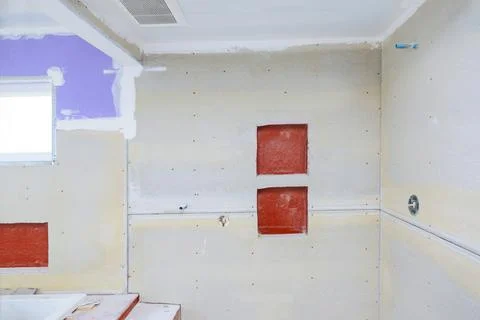 New under construction bathroom interior with drywall and patching Stock-Fotos