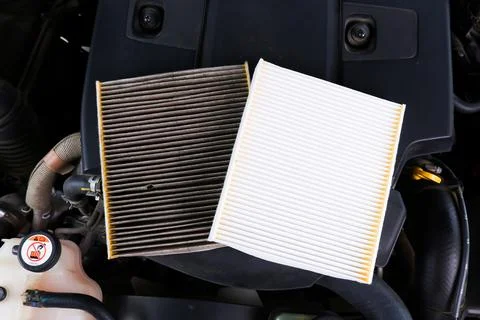 New vs. Dirty Engine Air Filter Stock Photos