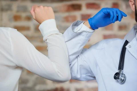 A new way of greeting to avoid the spread of coronavirus (COVID-19). Stock Photos