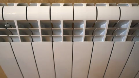 New white central heating radiator on the wall in room dolly shot Stock Footage 109230543