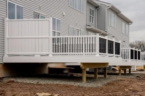 New white deck from the back of the house Stock Photos