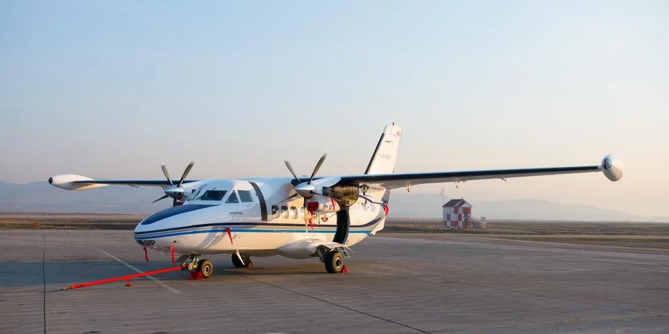 New white Let 410 airplane parked at the airport Baikal Stock Photos