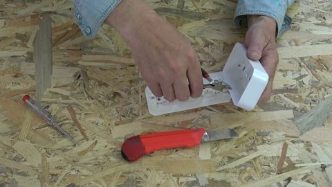 New white  socket in electrician hands Stock Footage 78516404