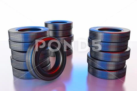 New winter tires with a modern tread on the black background. Stock Photos