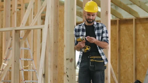 New Wooden Residential Building Developing. Caucasian Contractor Worker Stock Footage 296001111
