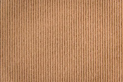 New wool carpet pattern closeup texture, brown color. Stock Photos