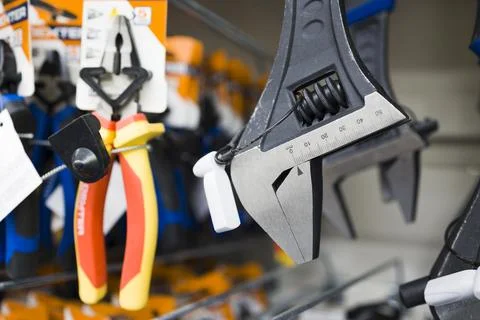 New wrench spanner in construction store . CLose up view , soft focus Stock Photos