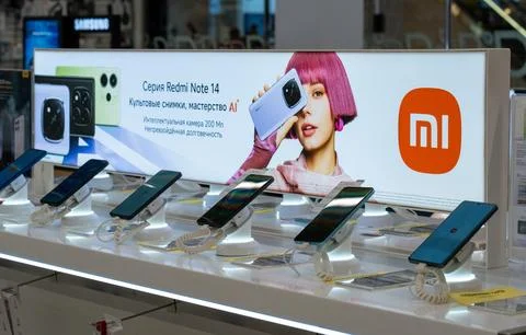 New Xiaomi smartphone at an electronics store. Minsk, Belarus - March 31, 2025 库存照片