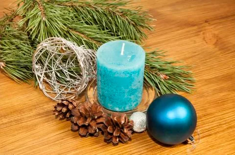 New Year 2017 composition with blue ball and candle on wooden background Stock Photos