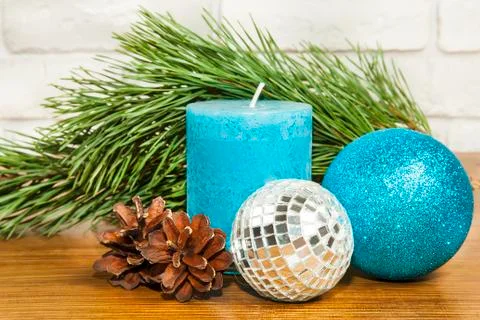 New Year 2017 composition with bright blue glitter ball and candle on wooden  Stock Photos