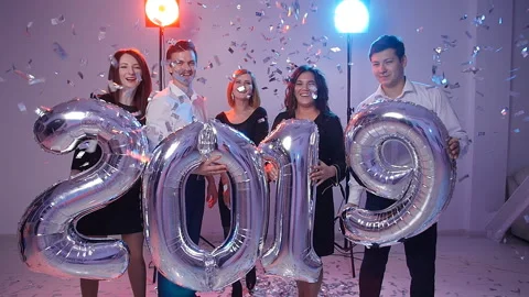New year 2019 concept. Group of cheerful young people holding number balloons Stock Footage 97101673