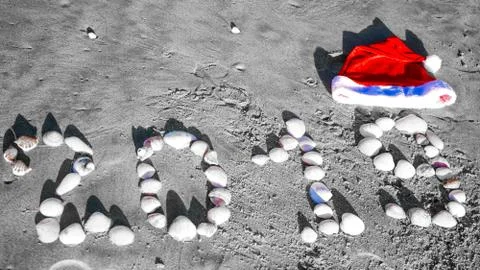 The New Year 2019 number with shells on sandy beach on holiday resort concept. Stock Photos