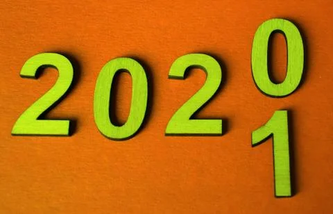 New year 2020 change of concept for 2021, change of yellow numbers on an oran Foto stock