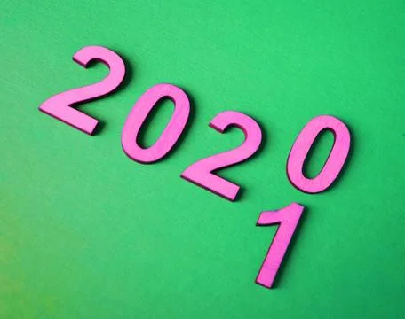 The new year 2020 changes the concept to 2021, pink on a green background Stock Photos