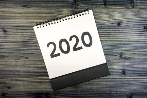 New year 2020 concept: flat lay of desktop calendar Stock Photos