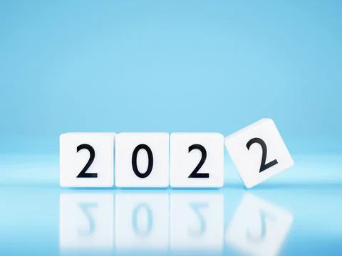 New year 2022 concept - white Plastic cubes on blue background. Change calend Stock Illustration