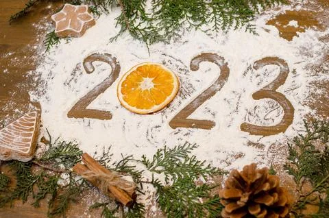 New Year 2023 data text close up written inscription on a wooden table on flour Stock Photos