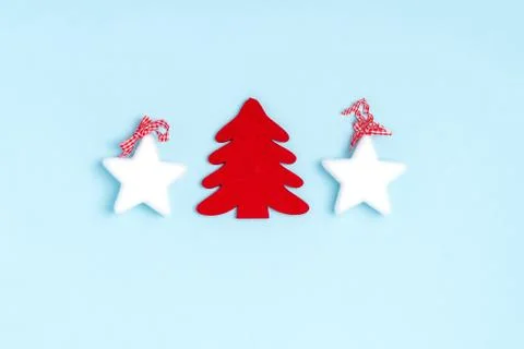 New Year and Christmas composition from stars, chrismas tree on pastel blue b Stock Photos