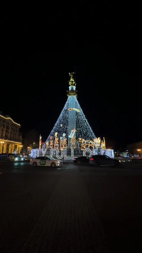 New Year and Christmas decor with glowing text "City full of kindness" Video stock 343801372