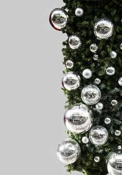 New Year and disco silver balls with glass elements, green Christmas tree Stock Photos
