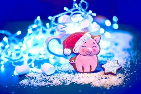 New Year background with biscuits in the form of a cute pig as a symbol of th Stock Photos