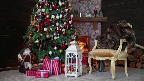 New Year background with presents and flashing garland on the tree Video stock 80898197