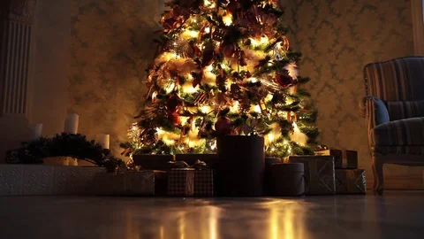 New Year background with presents and flashing garland on the tree Stock Footage 80898198