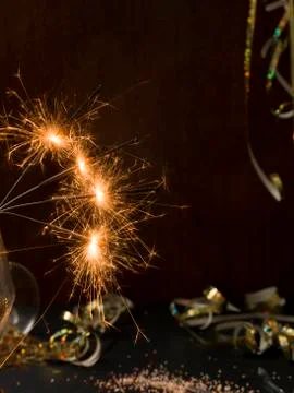 New year background with star splatter and sparkler Stock Photos