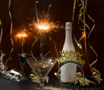 New year background with star splatter and sparkler Stock Photos