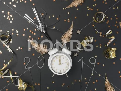 New year background with white alarm clock on chalkboard with different items Stock Photos