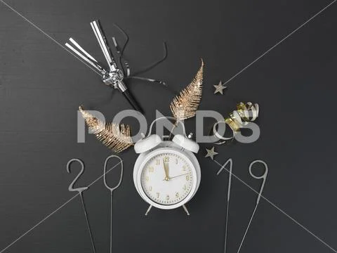 New year background with white alarm clock on chalkboard with different items Stock Photos