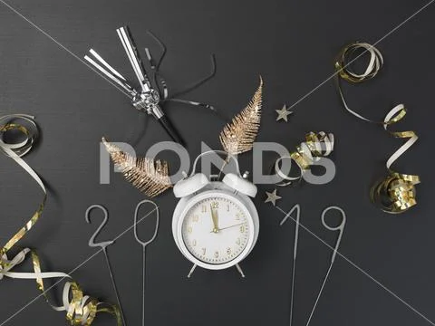 New year background with white alarm clock on chalkboard with different items Stock Photos