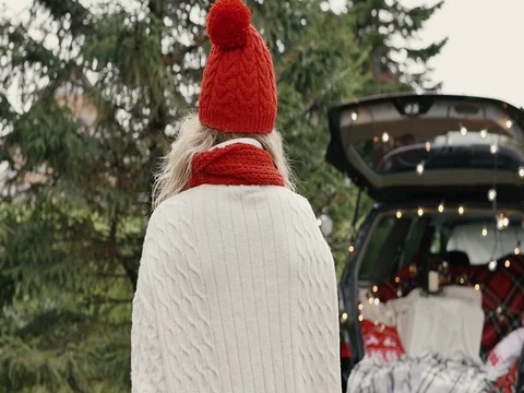 New Year. Beautiful girl in the trunk of her car is happy smiling Stock Footage