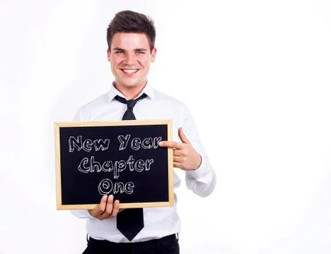 New Year Chapter One - Young smiling businessman holding chalkboard with text Stock Photos