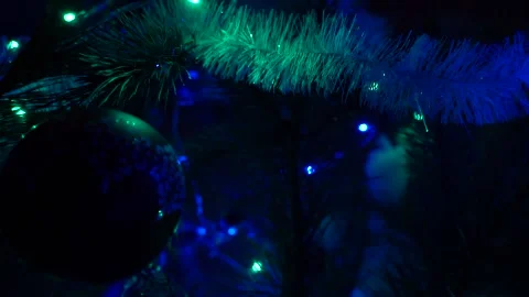 New year Christmas tree lights glittering at night. New Year fir tree with Stock Footage 146095098
