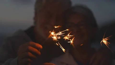 New year. close up of seniors celebrating the new year together at the beach wit Stock Footage 143362753