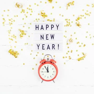 New Year composition alarm clock golden confetti Stock Photos