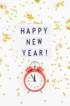 New Year composition alarm clock golden confetti Stock Photos