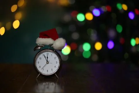 New year composition with alarm clock and beautiful bokeh in the background Stock Photos